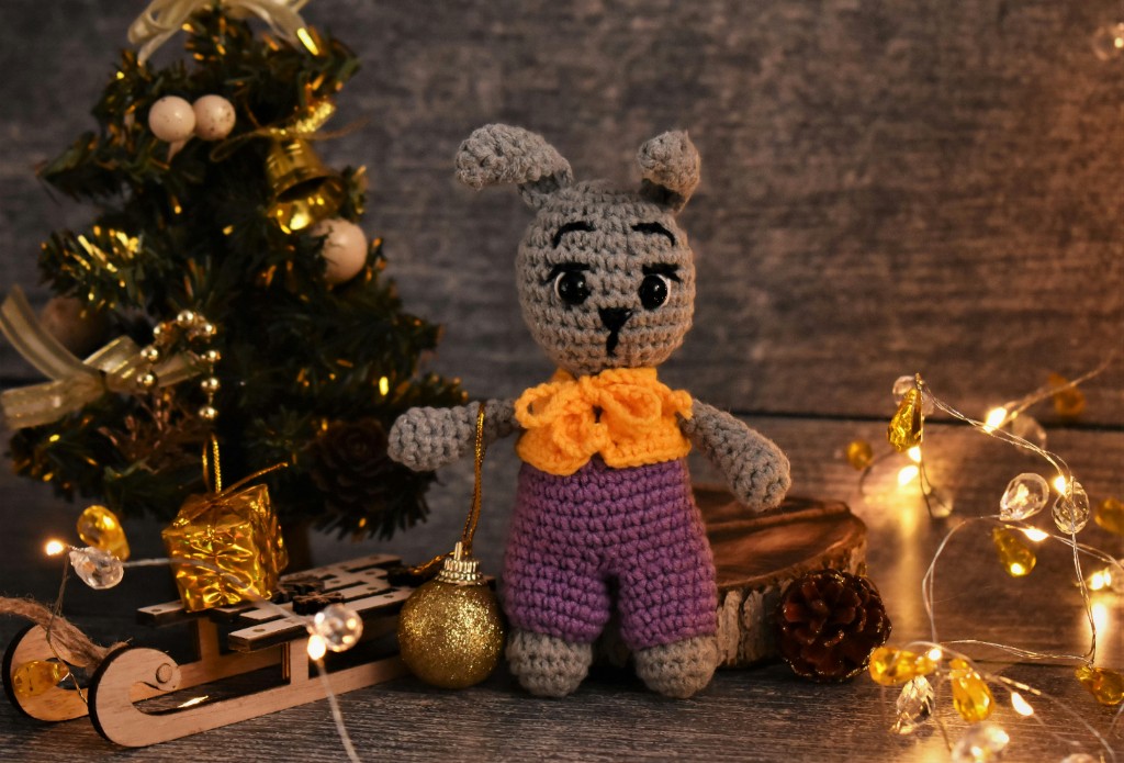 Crocheted yarn character and soft fibres on display in the studio
